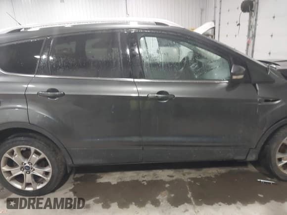 ✅ 2015 Ford Escape Titanium • VIN: 1FMCU9JX5FUA35888 • Lot: 41209408. Listed on IAAI with 125,378 mi. Free auction sales archive from the USA and detailed vehicle history report at DreamBid. Image 13.
