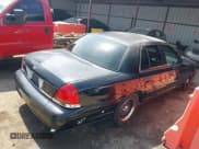 ✅ 1999 Ford Crown Victoria Police • VIN: 2FAFP71WXXX184415 • Lot: 41908080. Listed on IAAI with 221,602 mi. Free auction sales archive from the USA and detailed vehicle history report at DreamBid. Image 4.