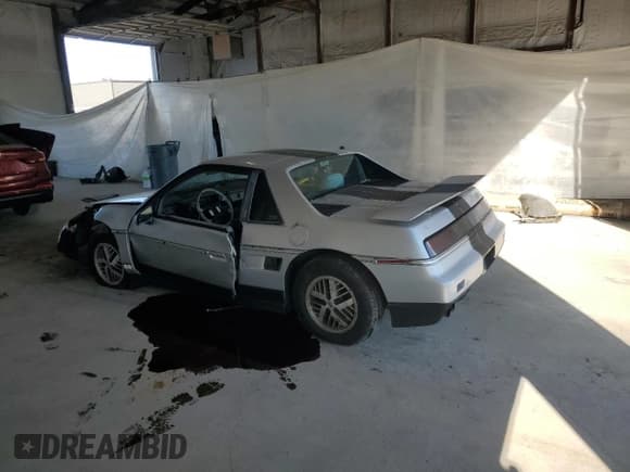 ✅ 1987 Pontiac Fiero • VIN: 1G2PF1191HP224790 • Lot: 70424675. Listed on Copart with 90,703 mi. Free auction sales archive from the USA and detailed vehicle history report at DreamBid. Image 2.