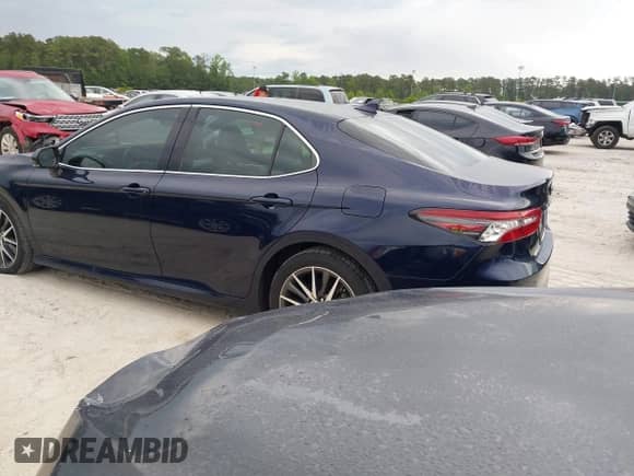 2022 Toyota Camry Hybrid XLE with VIN 4T1F31AK4NU591517, listed as a IAAI auction lot 42216959 with 36,048 mi miles and . Bid and sale history available at DreamBid. Image 3.