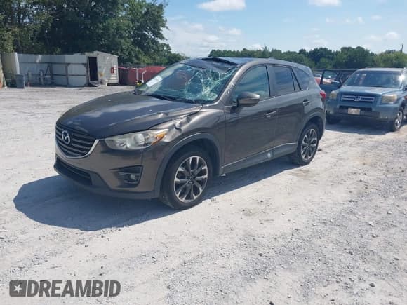 ✅ 2016 Mazda CX-5 Grand Touring • VIN: JM3KE2DY7G0782899 • Lot: 42949510. Wystawiony na IAAI z przebiegiem 85 502 mil. Bezpłatny archiwum sprzedaży aukcyjnych z USA i szczegółowy raport historii pojazdu na DreamBid. Zdjęcie 2.