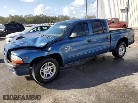 2002 Dodge Dakota Sport с VIN 1B7HL38N72S589857, выставлен на аукционе Copart как лот 77138924 с пробегом 197 117 миль миль и Списание • Salvage title. История ставок и продаж доступна на DreamBid. Изображение 1.