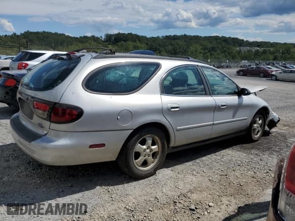✅ 2004 Ford Taurus SE • VIN: 1FAFP582X4A197483 • Lot: 69865775. Listed on Copart with 171,301 mi. Free auction sales archive from the USA and detailed vehicle history report at DreamBid. Image 3.