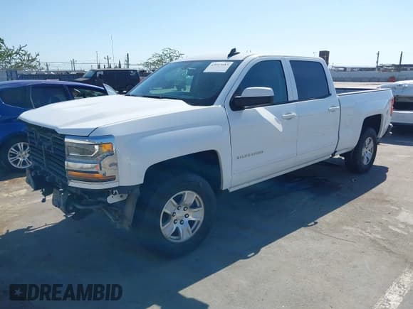 ✅ 2018 Chevrolet Silverado 1500 LT • VIN: 3GCPCREC7JG428237 • Lot: 43057683. Listed on IAAI with 137,294 mi. Free auction sales archive from the USA and detailed vehicle history report at DreamBid. Image 2.