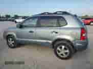 2006 Hyundai Tucson GL with VIN KM8JM12B86U411849, listed as a Copart auction lot 69301264 with 125,056 mi miles and Salvage title. Bid and sale history available at DreamBid. Image 2.