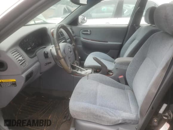 ✅ 2005 Kia Optima LX • VIN: KNAGD128455410979 • Lot: 71929355. Wystawiony na Copart z przebiegiem 219 338 mil. Bezpłatny archiwum sprzedaży aukcyjnych z USA i szczegółowy raport historii pojazdu na DreamBid. Zdjęcie 7.