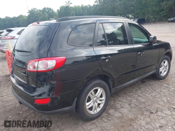 ✅ 2012 Hyundai Santa Fe GLS • VIN: 5XYZGDAG2CG144556 • Lot: 42596221. Listed on IAAI with 164,813 mi. Free auction sales archive from the USA and detailed vehicle history report at DreamBid. Image 4.