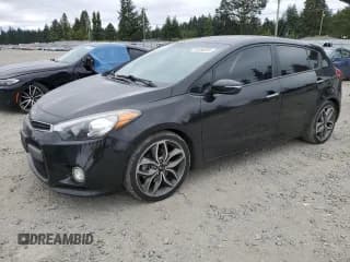 ✅ 2015 Kia Forte SX • VIN: KNAFZ5A39F5422217 • Лот: 66556865. Опубликован ранее на Copart с пробегом 125 249 миль. Бесплатный доступ к архиву аукционных продаж из США и подробный отчёт об истории автомобиля на DreamBid. Изображение 1.