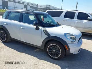 ✅ 2016 MINI Countryman S • VIN: WMWZC3C52GWP53590 • Lot: 43557835. Listed on IAAI with 104,765 mi. Free auction sales archive from the USA and detailed vehicle history report at DreamBid. Image 1.