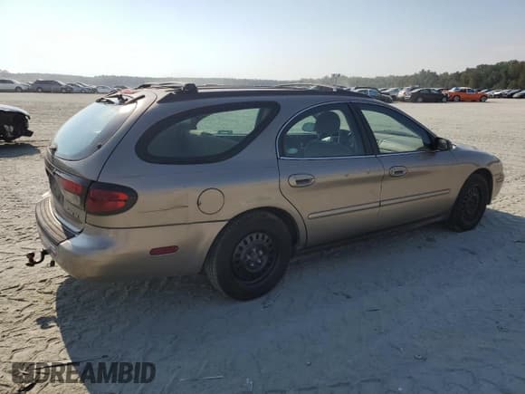 ✅ 2003 Mercury Sable GS • VIN: 1MEFM58U33A600317 • Lot: 81146225. Listed on Copart with 193,006 mi. Free auction sales archive from the USA and detailed vehicle history report at DreamBid. Image 3.