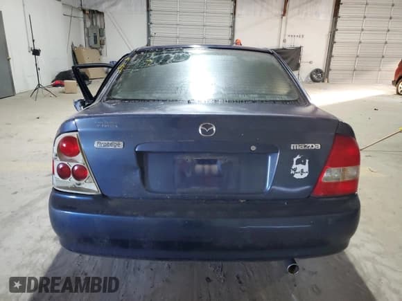 ✅ 2000 Mazda Protege ES • VIN: JM1BJ221XY0211385 • Lot: 48225605. Listed on Copart with Not provided. Free auction sales archive from the USA and detailed vehicle history report at DreamBid. Image 6.