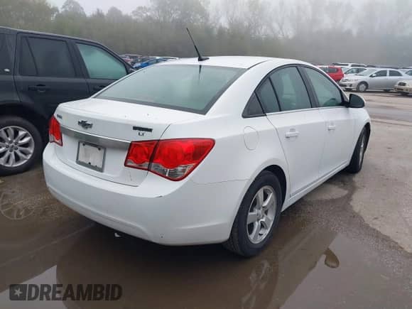 2014 Chevrolet Cruze 1LT with VIN 1G1PC5SB5E7312954, listed as a IAAI auction lot 43586516 with 151,548 mi miles and . Bid and sale history available at DreamBid. Image 4.