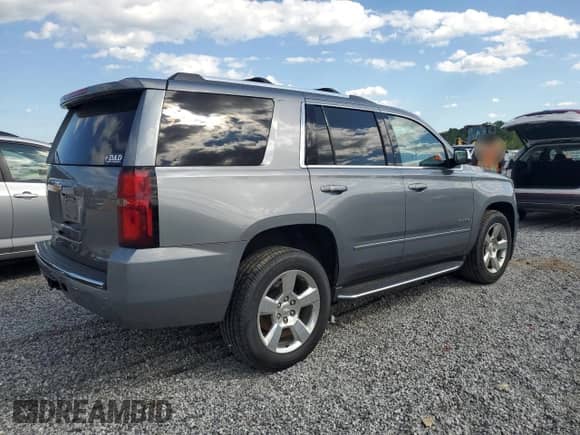 2020 Chevrolet Tahoe Premier with VIN 1GNSKCKC1LR216510, listed as a Copart auction lot 57627705 with 113,495 mi miles and Salvage title. Bid and sale history available at DreamBid. Image 3.
