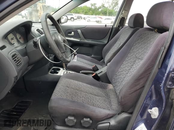 ✅ 2003 Mazda Protege • VIN: JM1BJ245931128629 • Lot: 81700205. Listed on Copart with 107,189 mi. Free auction sales archive from the USA and detailed vehicle history report at DreamBid. Image 7.