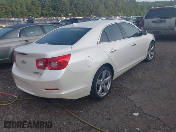 2013 Chevrolet Malibu LTZ with VIN 1G11J5SX5DF223834, listed as a IAAI auction lot 42792315 with 208,506 mi miles and . Bid and sale history available at DreamBid. Image 4.
