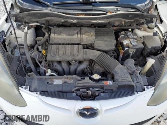 ✅ 2014 Mazda 2 Sport • VIN: JM1DE1KY5E0172866 • Лот: 73997744. Опубликован ранее на Copart с пробегом 181 163 миль. Бесплатный доступ к архиву аукционных продаж из США и подробный отчёт об истории автомобиля на DreamBid. Изображение 11.