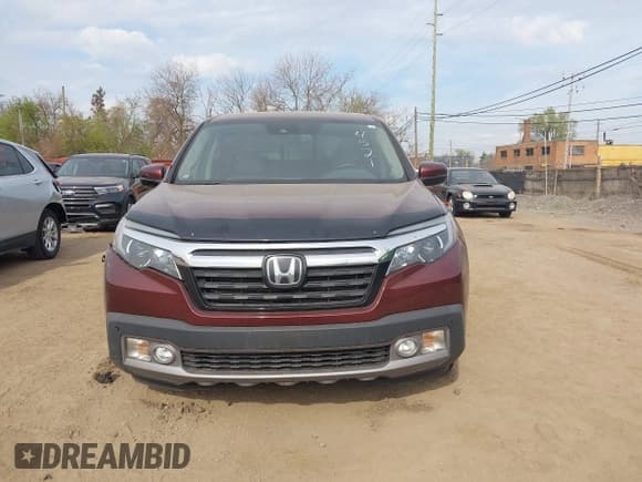 ✅ 2018 Honda Ridgeline RTL-E • VIN: 5FPYK3F76JB004521 • Lot: 42120949. Listed on IAAI with 131,637 mi. Free auction sales archive from the USA and detailed vehicle history report at DreamBid. Image 12.