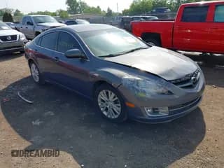 ✅ 2009 Mazda 6 i Touring • VIN: 1YVHP82A895M36284 • Lot: 42279453. Listed on IAAI with 149,640 mi. Free auction sales archive from the USA and detailed vehicle history report at DreamBid. Image 1.