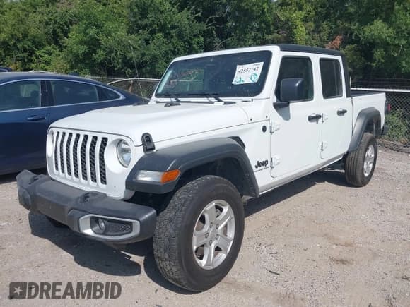 ✅ 2023 Jeep Gladiator Sport S • VIN: 1C6HJTAGXPL539965 • Лот: 42552742. Опубликован ранее на IAAI с пробегом 57 918 миль. Бесплатный доступ к архиву аукционных продаж из США и подробный отчёт об истории автомобиля на DreamBid. Изображение 2.