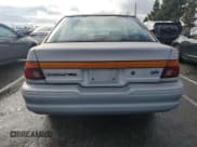 ✅ 1993 Ford Escort • VIN: 1FAPP14J4PW127964 • Lot: 92805235. Wystawiony na Copart z przebiegiem 82 099 mil. Bezpłatny archiwum sprzedaży aukcyjnych z USA i szczegółowy raport historii pojazdu na DreamBid. Zdjęcie 6.