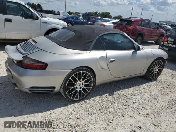 ✅ 2003 Porsche 911 • VIN: WP0CA29903S653377 • Лот: 66890114. Опубликован ранее на Copart с пробегом Не указан. Бесплатный доступ к архиву аукционных продаж из США и подробный отчёт об истории автомобиля на DreamBid. Изображение 3.