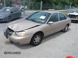 ✅ 1999 Mercury Mystique GS • VIN: 1MEFM6532XK635416 • Лот: 42552621. Опубликован ранее на IAAI с пробегом 184 396 миль. Бесплатный доступ к архиву аукционных продаж из США и подробный отчёт об истории автомобиля на DreamBid. Изображение 2.