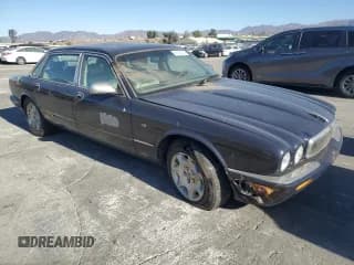 ✅ 2002 Jaguar XJ Vanden Plas • VIN: SAJDA24C52LF42702 • Лот: 41927545. Опубликован ранее на Copart с пробегом Не указан. Бесплатный доступ к архиву аукционных продаж из США и подробный отчёт об истории автомобиля на DreamBid. Изображение 4.