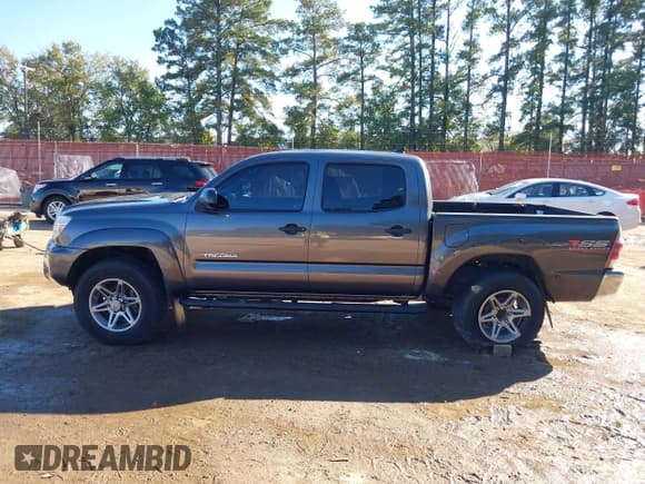 ✅ 2014 Toyota Tacoma PreRunner • VIN: 5TFJU4GN5EX058881 • Lot: 43603920. Listed on IAAI with 170,876 mi. Free auction sales archive from the USA and detailed vehicle history report at DreamBid. Image 15.