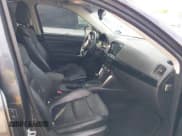 ✅ 2014 Mazda CX-5 Grand Touring • VIN: JM3KE4DYXE0305361 • Lot: 43498871. Listed on IAAI with 253,119 mi. Free auction sales archive from the USA and detailed vehicle history report at DreamBid. Image 5.