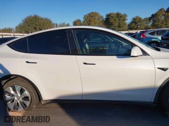 ✅ 2023 Tesla Model Y Long Range • VIN: 7SAYGDEE2PA058634 • Lot: 43570934. Listed on IAAI with 40,478 mi. Free auction sales archive from the USA and detailed vehicle history report at DreamBid. Image 12.