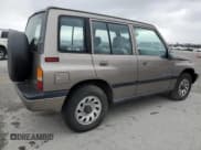 ✅ 1997 Suzuki Sidekick JX • VIN: 2S3TD03V4V6403519 • Lot: 49666085. Listed on Copart with 54,577 mi. Free auction sales archive from the USA and detailed vehicle history report at DreamBid. Image 3.