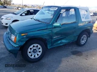 ✅ 1995 Suzuki Sidekick • VIN: 2S3TA02C3S6414337 • Lot: 86304134. Listed on Copart with 104,889 mi. Free auction sales archive from the USA and detailed vehicle history report at DreamBid. Image 1.