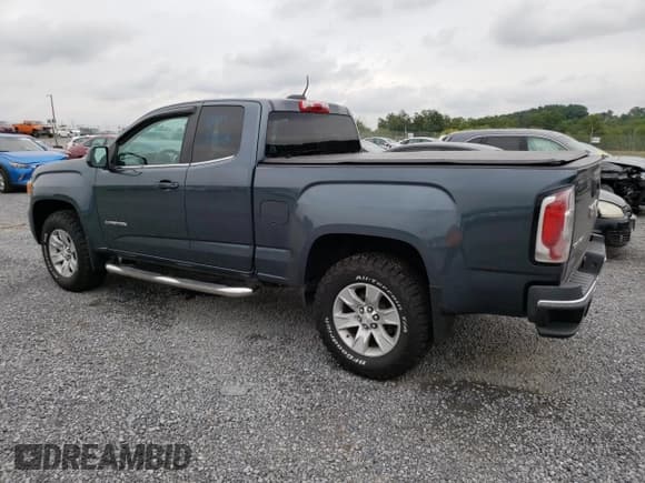 ✅ 2015 GMC Canyon 2WD SLE • VIN: 1GTH5BEA7F1158758 • Лот: 63617524. Опубликован ранее на Copart с пробегом 102 744 миль. Бесплатный доступ к архиву аукционных продаж из США и подробный отчёт об истории автомобиля на DreamBid. Изображение 2.