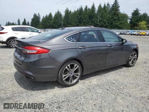 ✅ 2017 Ford Fusion Titanium • VIN: 3FA6P0K95HR139060 • Lot: 62200755. Listed on Copart with 106,133 mi. Free auction sales archive from the USA and detailed vehicle history report at DreamBid. Image 3.