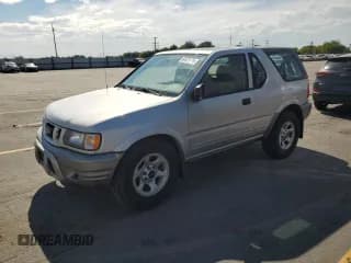 ✅ 2002 Isuzu Rodeo • VIN: 4S2CK57D524319746 • Lot: 67871635. Listed on Copart with 169,764 mi. Free auction sales archive from the USA and detailed vehicle history report at DreamBid. Image 1.
