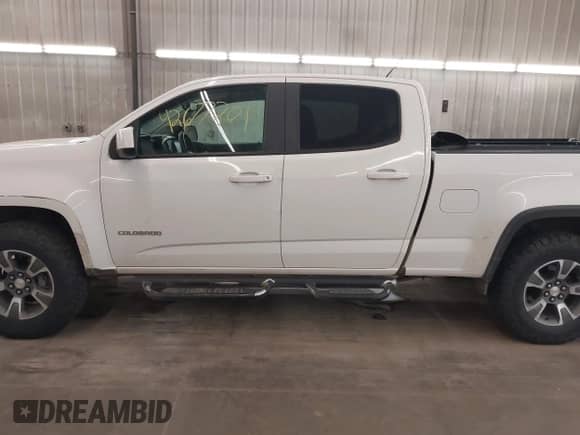 2015 Chevrolet Colorado 4WD Z71 z VIN 1GCGTCE36F1265552, wystawiony jako IAAI lot #42677201 z przebiegiem 168 895 mil mil oraz . Historia ofert i sprzedaży dostępna na DreamBid. Obrazek 15.