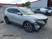 ✅ 2017 Nissan Rogue SV • VIN: JN8AT2MT7HW380107 • Lot: 43618034. Listed on IAAI with 99,472 mi. Free auction sales archive from the USA and detailed vehicle history report at DreamBid. Image 1.