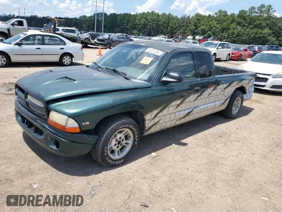 1999 Dodge Dakota SLT z VIN 1B7GL22X0XS145128, wystawiony jako Copart lot #64959364 z przebiegiem 96 047 mil mil oraz Szkoda całkowita • Salvage title. Historia ofert i sprzedaży dostępna na DreamBid. Obrazek 1.