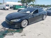 ✅ 2014 Tesla Model S P85D • VIN: 5YJSA1H25EFP65571 • Lot: 42185442. Listed on IAAI with 115,990 mi. Free auction sales archive from the USA and detailed vehicle history report at DreamBid. Image 2.