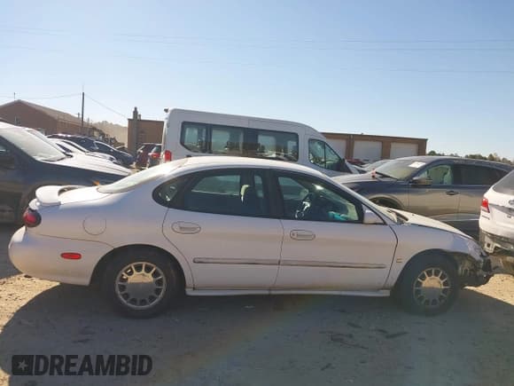 ✅ 1998 Ford Taurus SE Comfort • VIN: 1FAFP53S6WA158707 • Lot: 43664264. Wystawiony na IAAI z przebiegiem 94 283 mil. Bezpłatny archiwum sprzedaży aukcyjnych z USA i szczegółowy raport historii pojazdu na DreamBid. Zdjęcie 13.