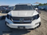 ✅ 2022 Honda Pilot Touring 7-Passenger • VIN: 5FNYF6H62NB007148 • Lot: 69777725. Listed on Copart with 54,748 mi. Free auction sales archive from the USA and detailed vehicle history report at DreamBid. Image 5.