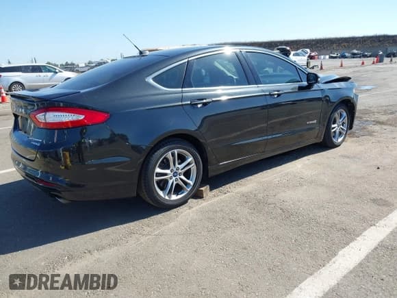✅ 2015 Ford Fusion Titanium Hybrid • VIN: 3FA6P0RU4FR214483 • Лот: 42327816. Опубликован ранее на IAAI с пробегом 149 007 миль. Бесплатный доступ к архиву аукционных продаж из США и подробный отчёт об истории автомобиля на DreamBid. Изображение 4.