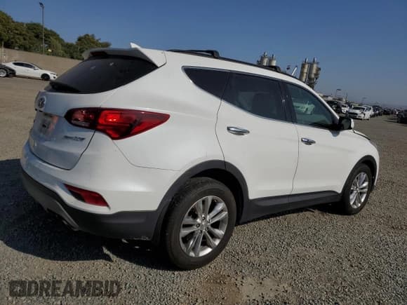 ✅ 2018 Hyundai Santa Fe 2.0T • VIN: 5XYZU4LA0JG554836 • Лот: 65013984. Опубликован ранее на Copart с пробегом 102 398 миль. Бесплатный доступ к архиву аукционных продаж из США и подробный отчёт об истории автомобиля на DreamBid. Изображение 3.