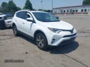 ✅ 2018 Toyota RAV4 XLE • VIN: 2T3WFREV1JW459553 • Lot: 42423474. Listed on IAAI with 129,523 mi. Free auction sales archive from the USA and detailed vehicle history report at DreamBid. Image 1.
