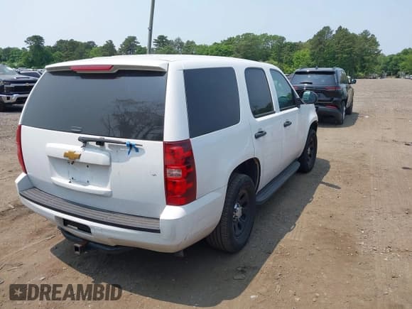 ✅ 2014 Chevrolet Tahoe Commercial • VIN: 1GNLC2E07ER228838 • Lot: 42410417. Listed on IAAI with 140,342 mi. Free auction sales archive from the USA and detailed vehicle history report at DreamBid. Image 4.