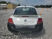 ✅ 2016 Volkswagen Beetle Dune • VIN: 3VWS17AT7GM621747 • Лот: 67525035. Опубликован ранее на Copart с пробегом 94 524 миль. Бесплатный доступ к архиву аукционных продаж из США и подробный отчёт об истории автомобиля на DreamBid. Изображение 6.