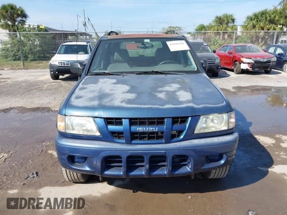 ✅ 2004 Isuzu Rodeo S • VIN: 4S2CK58W944317209 • Lot: 41498160. Listed on IAAI with 114,764 mi. Free auction sales archive from the USA and detailed vehicle history report at DreamBid. Image 6.