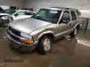 2000 Chevrolet Blazer LT z VIN 1GNDT13W3Y2216351, wystawiony jako Copart lot #79067624 z przebiegiem 176 317 mil mil oraz Szkoda całkowita • Salvage title. Historia ofert i sprzedaży dostępna na DreamBid. Obrazek 1.