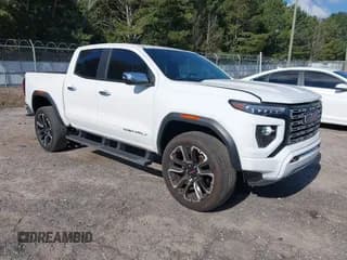 ✅ 2023 GMC Canyon 4WD Denali • VIN: 1GTP6FEK5P1218157 • Лот: 43363037. Опубликован ранее на IAAI с пробегом 33 434 миль. Бесплатный доступ к архиву аукционных продаж из США и подробный отчёт об истории автомобиля на DreamBid. Изображение 1.