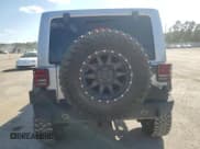 ✅ 2014 Jeep Wrangler Unlimited Sahara • VIN: 1C4BJWEG9EL198579 • Lot: 82073175. Listed on Copart with 84,727 mi. Free auction sales archive from the USA and detailed vehicle history report at DreamBid. Image 6.